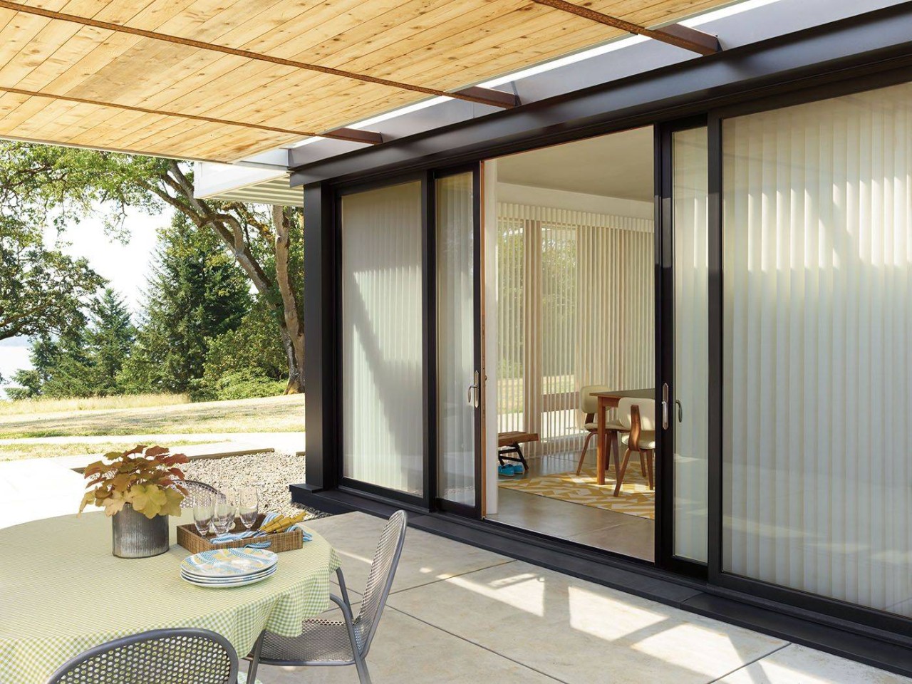 Hunter Douglas window treatments decorating sliding glass doors leading to an outdoor patio near Spokane, WA